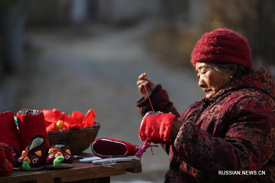 Детские тапочки "тигриная голова" от 85-летней Чжао Кайин