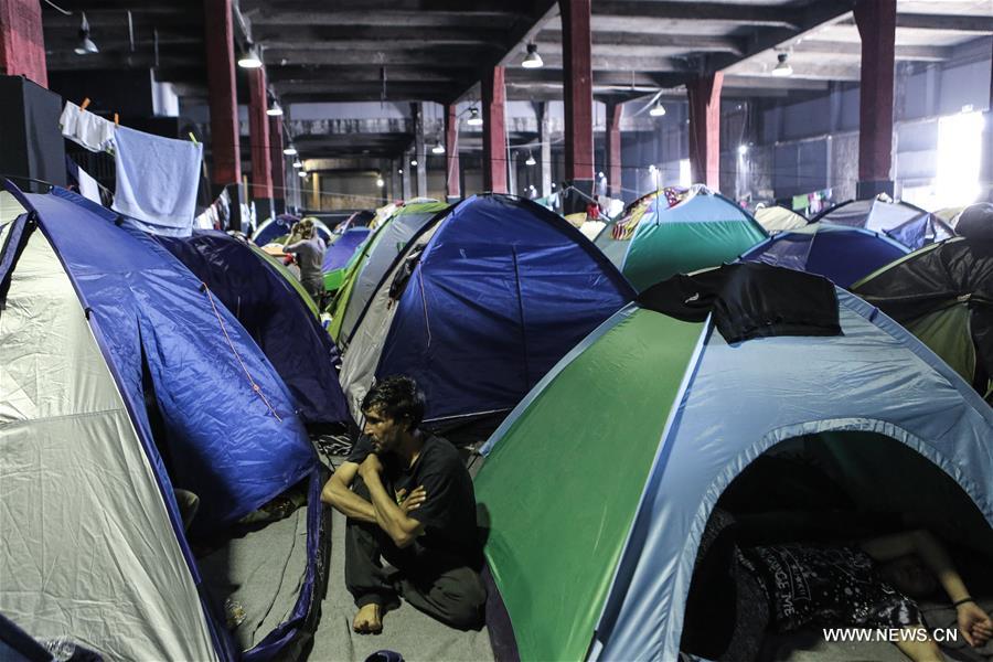 GREECE-PIRAEUS-REFUGEES-TOURISM